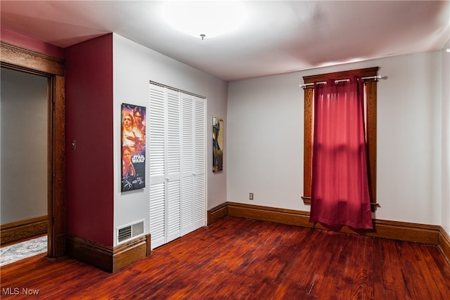 spare room featuring hardwood / wood-style flooring