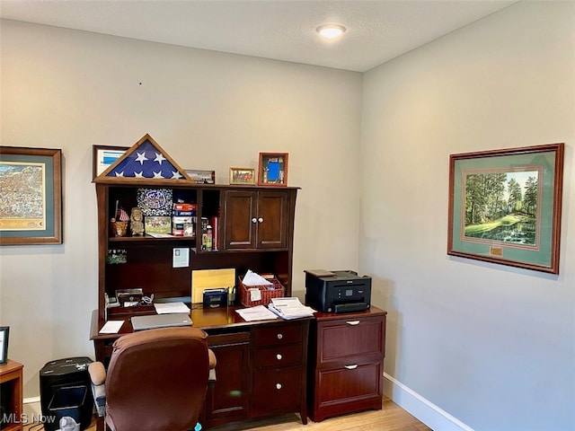 home office featuring light hardwood / wood-style floors