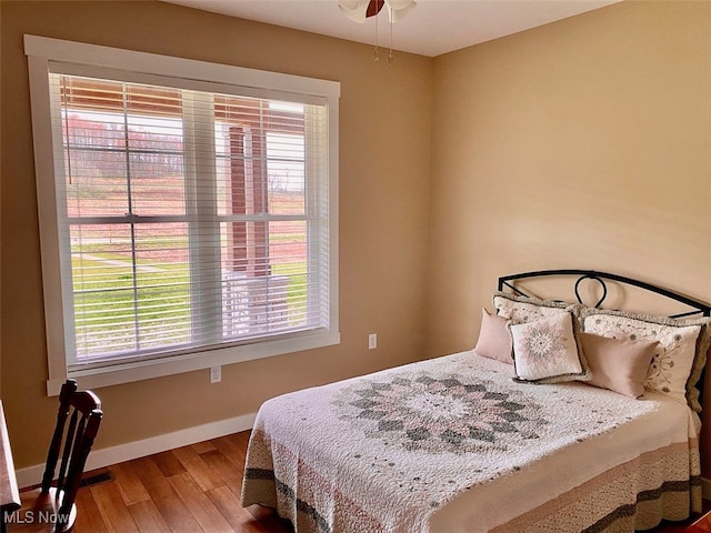 bedroom featuring ceiling fan and hardwood / wood-style floors