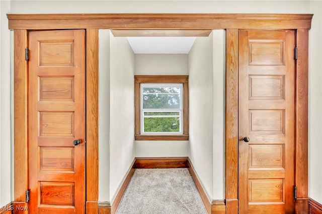 corridor with light colored carpet