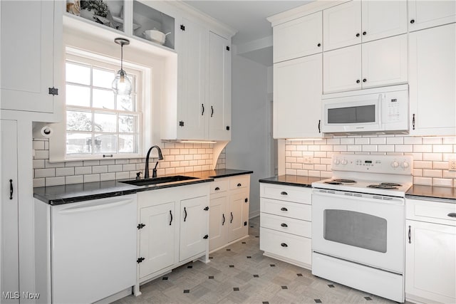 kitchen with sink, tasteful backsplash, white appliances, decorative light fixtures, and white cabinetry