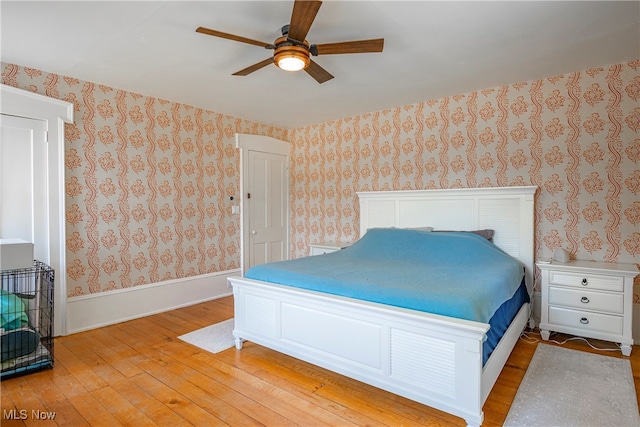 bedroom with light wood-type flooring and ceiling fan