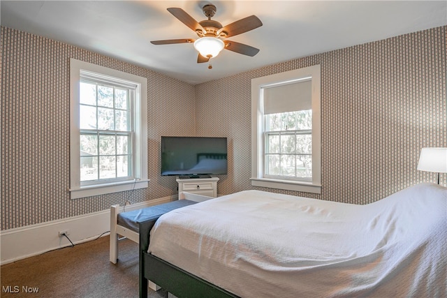 bedroom with ceiling fan and carpet floors