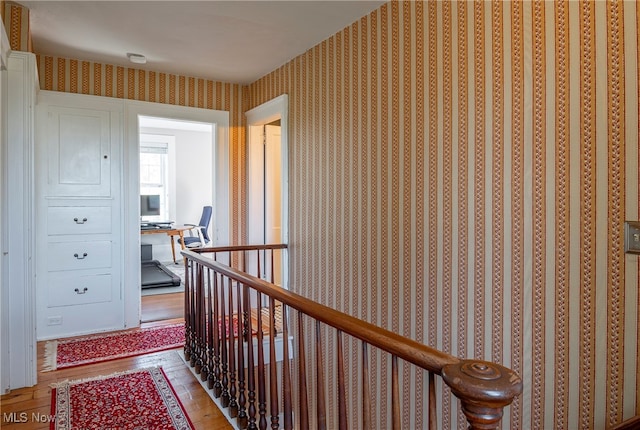 hallway with wood-type flooring