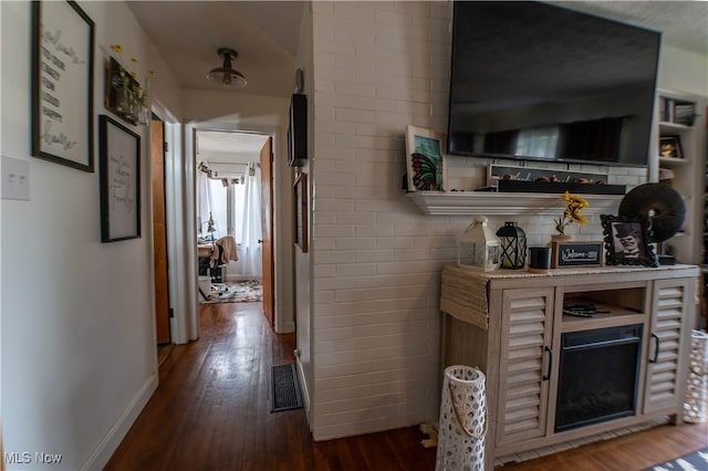 hall with dark wood-type flooring