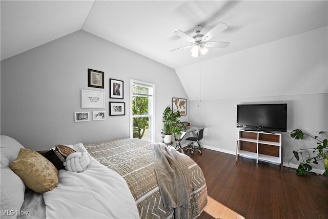 bedroom with ceiling fan, dark hardwood / wood-style floors, and vaulted ceiling