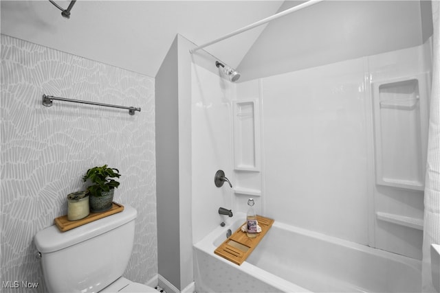 bathroom with shower / tub combination and toilet