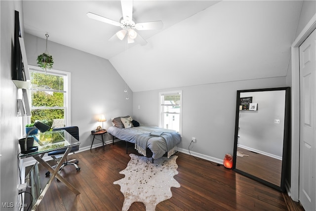 bedroom featuring lofted ceiling, dark hardwood / wood-style flooring, and ceiling fan