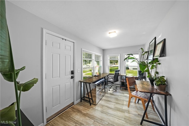 interior space with light hardwood / wood-style floors and a textured ceiling