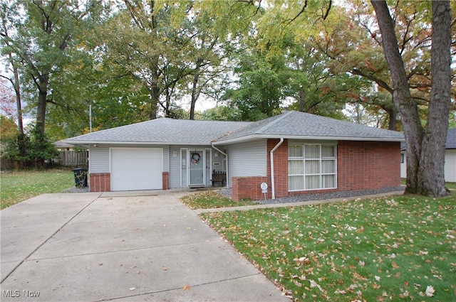 single story home with a front yard and a garage