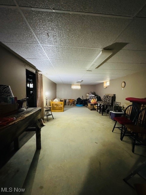 basement featuring a drop ceiling