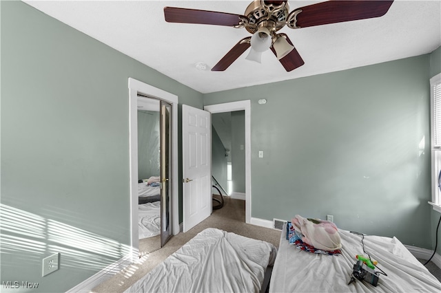 carpeted bedroom featuring ceiling fan