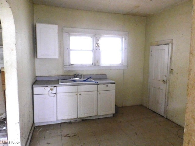 kitchen with sink and white cabinets