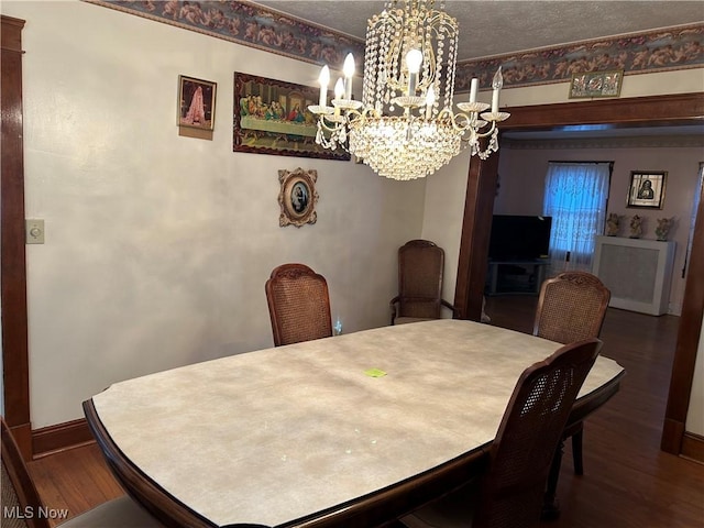 dining space with hardwood / wood-style flooring