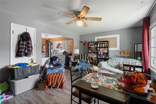 interior space featuring wood-type flooring and ceiling fan