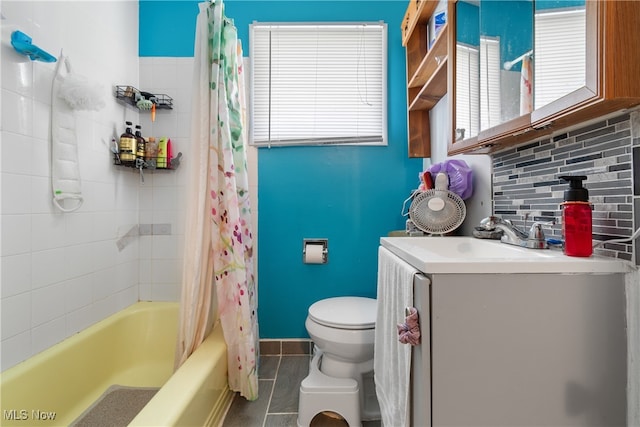 full bathroom featuring toilet, vanity, backsplash, and shower / tub combo