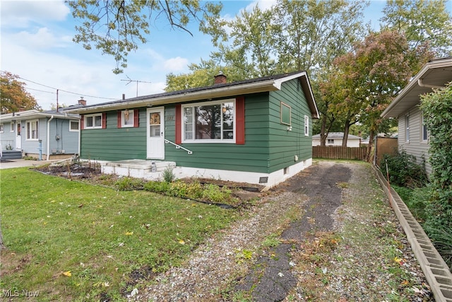 view of front of home with a front lawn