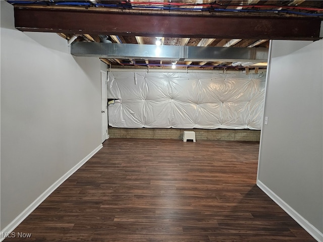 basement featuring dark hardwood / wood-style floors