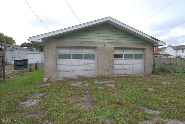 garage with a yard