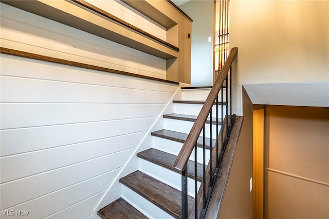 stairs featuring hardwood / wood-style flooring