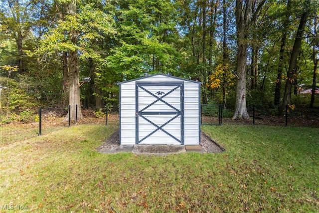 view of outdoor structure featuring a lawn