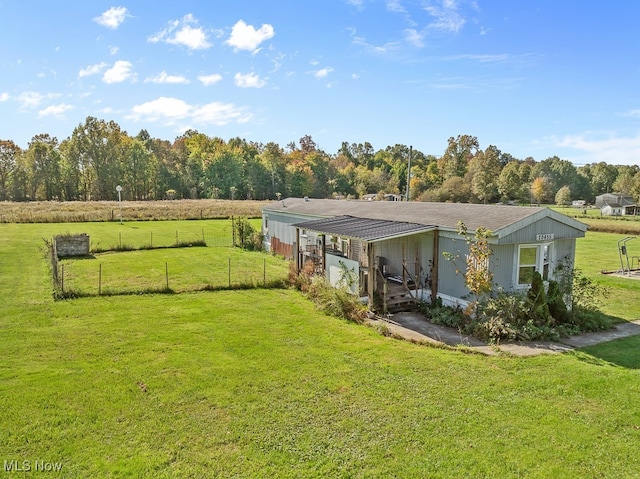 view of yard with a rural view