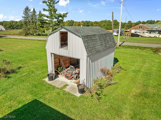 view of outdoor structure with a lawn