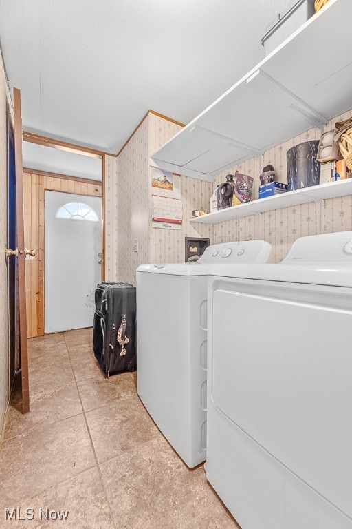 clothes washing area with washing machine and clothes dryer