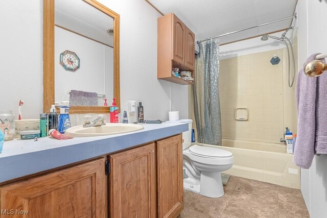 full bathroom featuring a textured ceiling, shower / bath combo, toilet, vanity, and tile patterned flooring