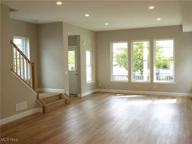 4424 W 53rd St, Cleveland, OH 44109 - foyer entrance with healthy amount of natural light, stairs, baseboards, recessed lighting, and light wood-style flooring