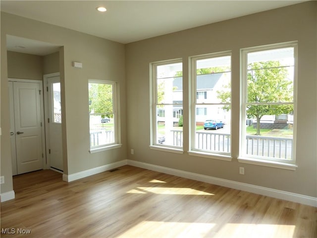 4424 W 53rd St, Cleveland, OH 44109 - spare room featuring light wood-style floors, baseboards, and recessed lighting