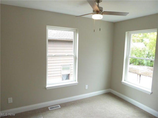 4424 W 53rd St, Cleveland, OH 44109 - empty room featuring baseboards, light carpet, and a ceiling fan
