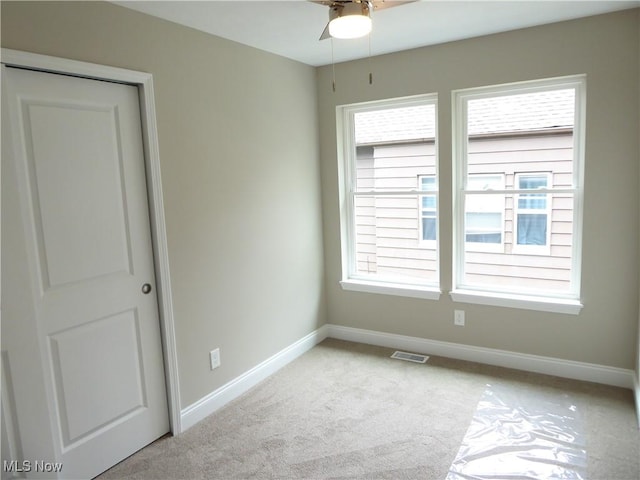 4424 W 53rd St, Cleveland, OH 44109 - carpeted spare room with baseboards and a ceiling fan
