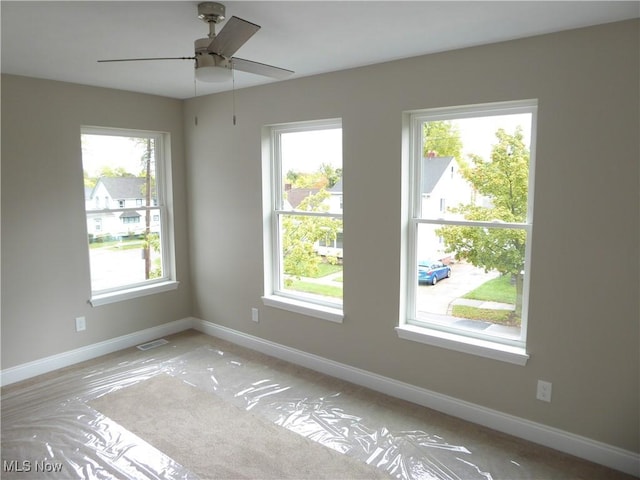 4424 W 53rd St, Cleveland, OH 44109 - unfurnished room with baseboards and a ceiling fan