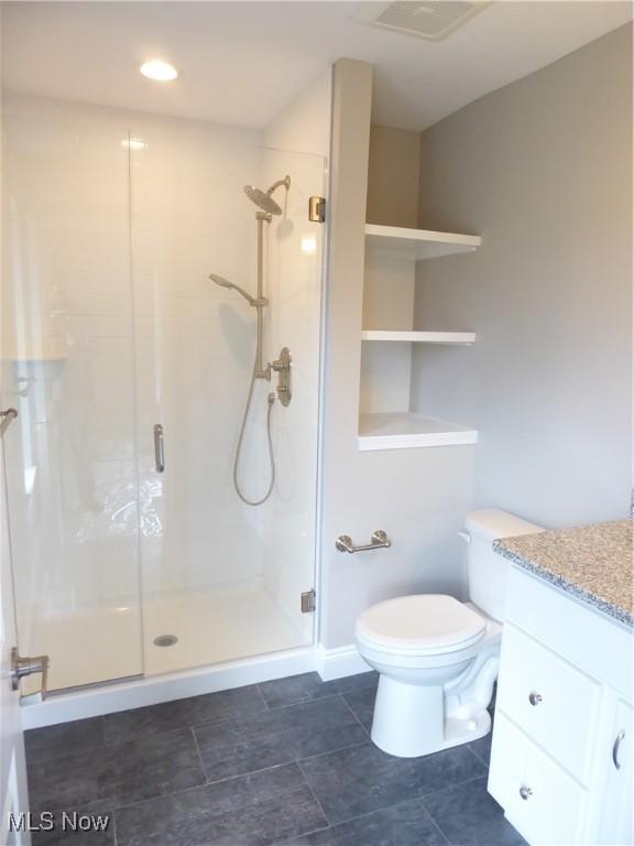 4424 W 53rd St, Cleveland, OH 44109 - bathroom featuring a stall shower, vanity, and toilet