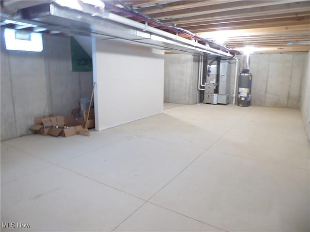 4424 W 53rd St, Cleveland, OH 44109 - below grade area featuring heating unit and water heater