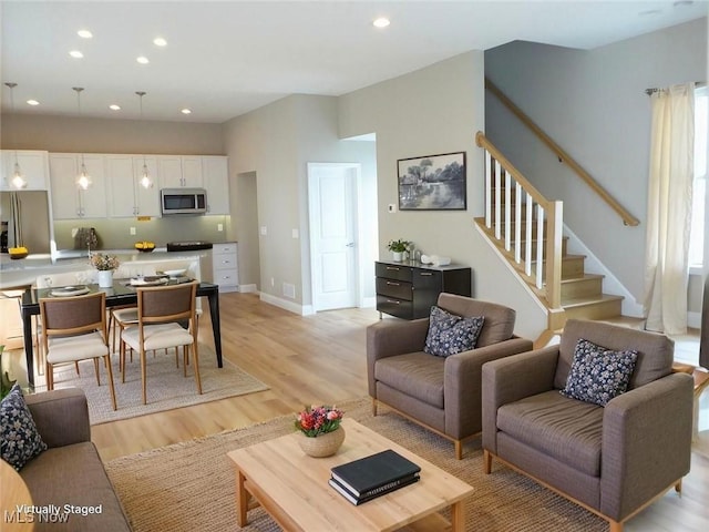 4424 W 53rd St, Cleveland, OH 44109 - living area featuring light wood-style flooring, recessed lighting, and stairs