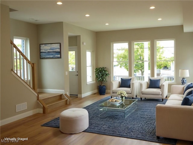 4424 W 53rd St, Cleveland, OH 44109 - living area featuring baseboards, wood finished floors, and recessed lighting