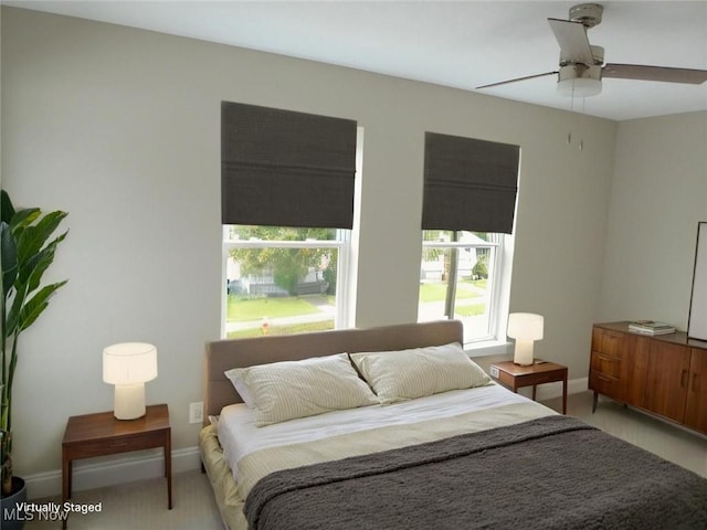 4424 W 53rd St, Cleveland, OH 44109 - carpeted bedroom with baseboards and a ceiling fan