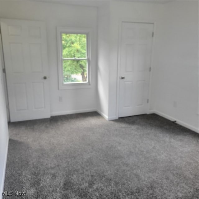 unfurnished room with carpet flooring