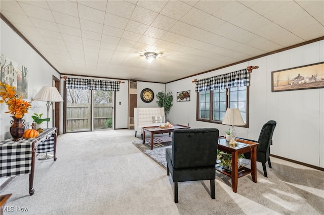 carpeted living room with ornamental molding