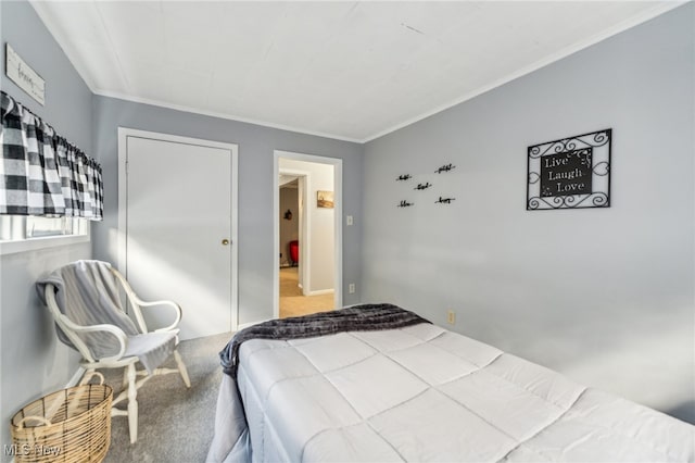 carpeted bedroom featuring ornamental molding