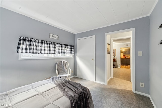 carpeted bedroom featuring crown molding