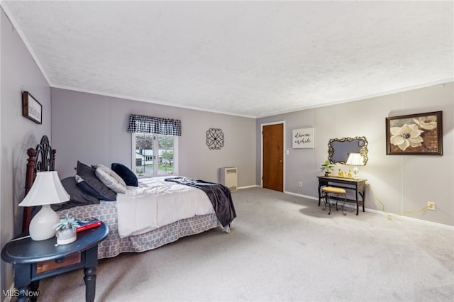 bedroom featuring carpet flooring and a textured ceiling