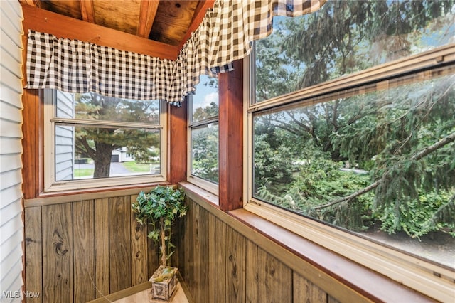 sunroom with beamed ceiling