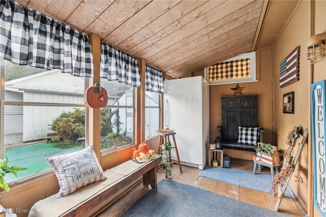 sunroom featuring wood ceiling and lofted ceiling