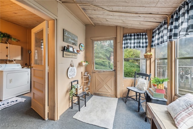 sunroom featuring washer / clothes dryer, vaulted ceiling, and wooden ceiling