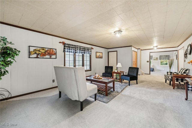 carpeted living room featuring ornamental molding