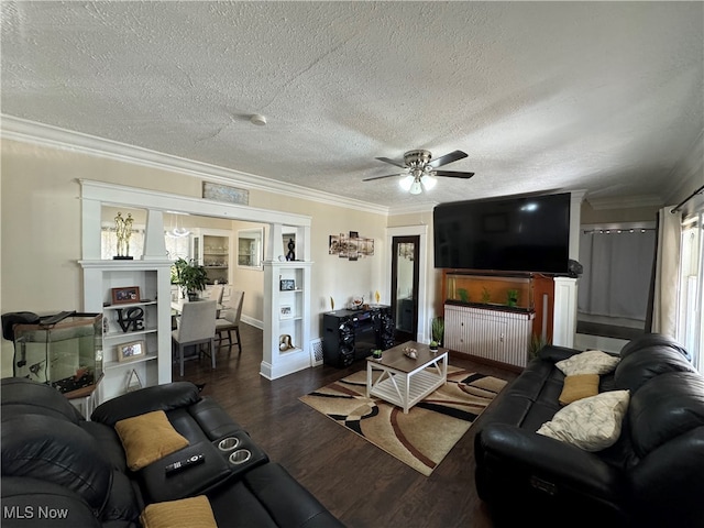 living room with a healthy amount of sunlight, ceiling fan, dark hardwood / wood-style flooring, a textured ceiling, and crown molding