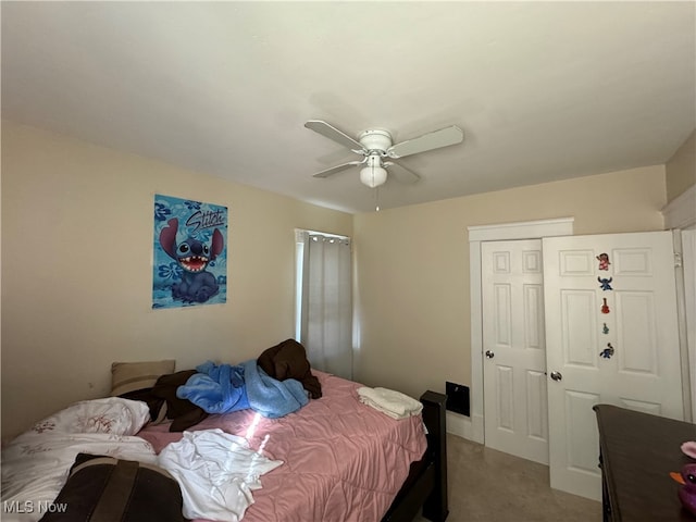 bedroom with carpet flooring, a closet, and ceiling fan